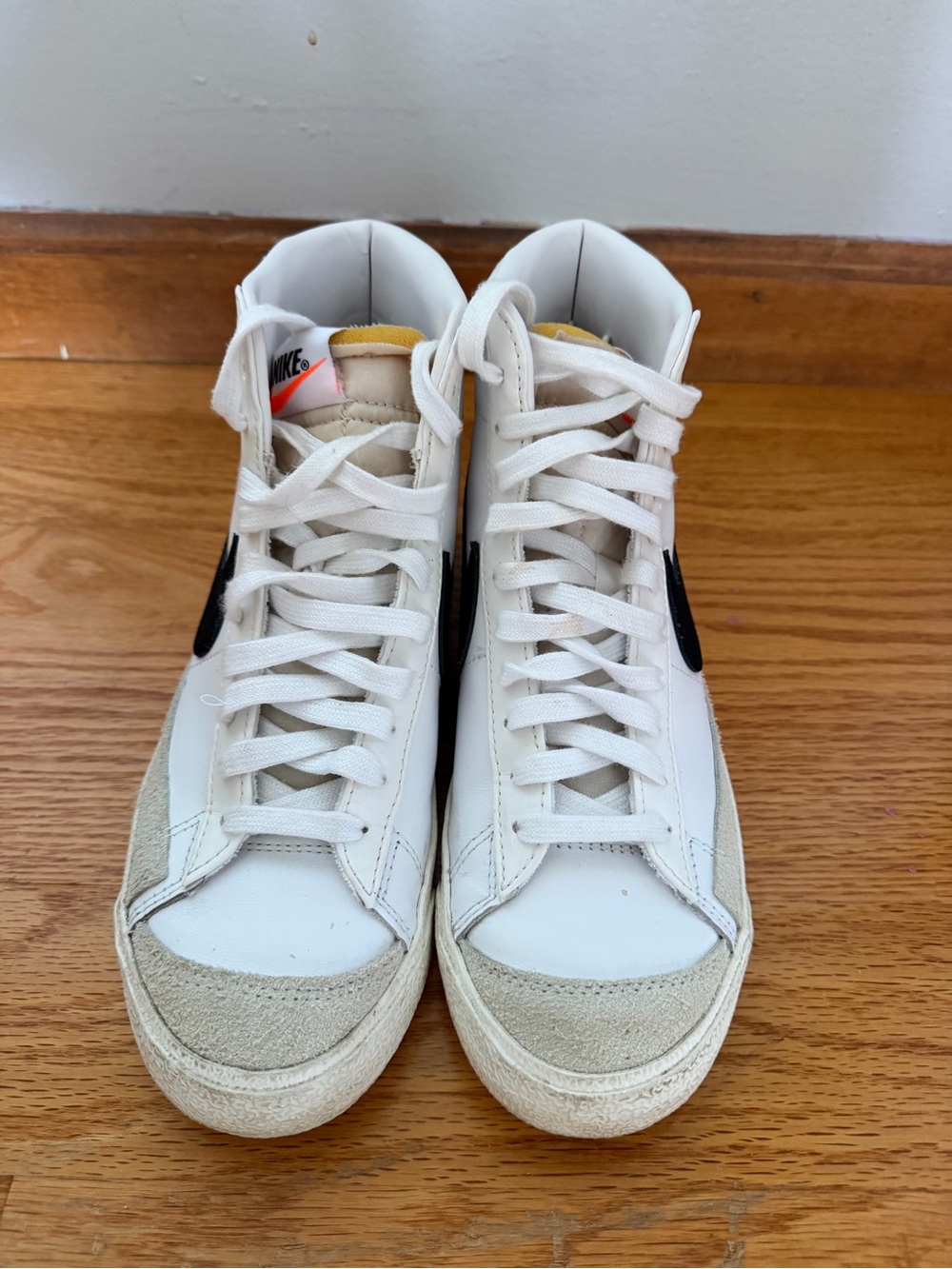 Nike White High-Top Sneakers with Black Swoosh and Beige Accents